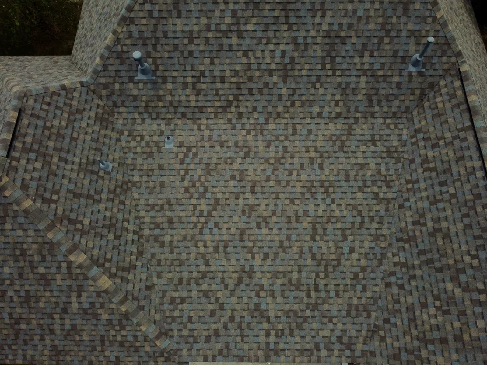 Close-up of fresh architectural shingles after replacement